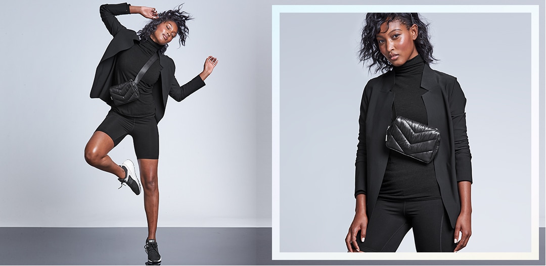 woman wearing black crop top, black yoga pants, with a black jacket draped on her back