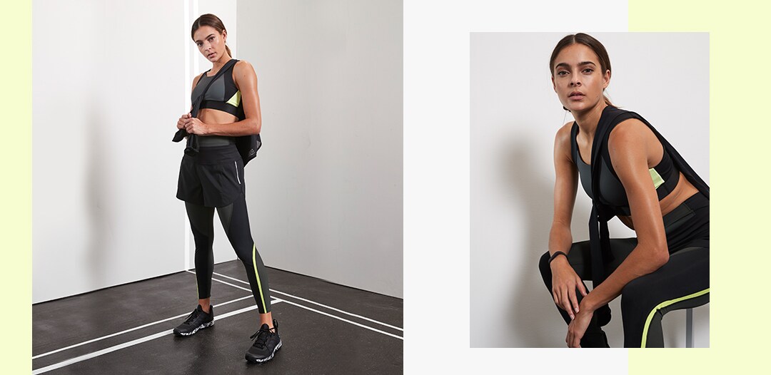 woman wearing black and yellow side stripe tights and matching sports bra