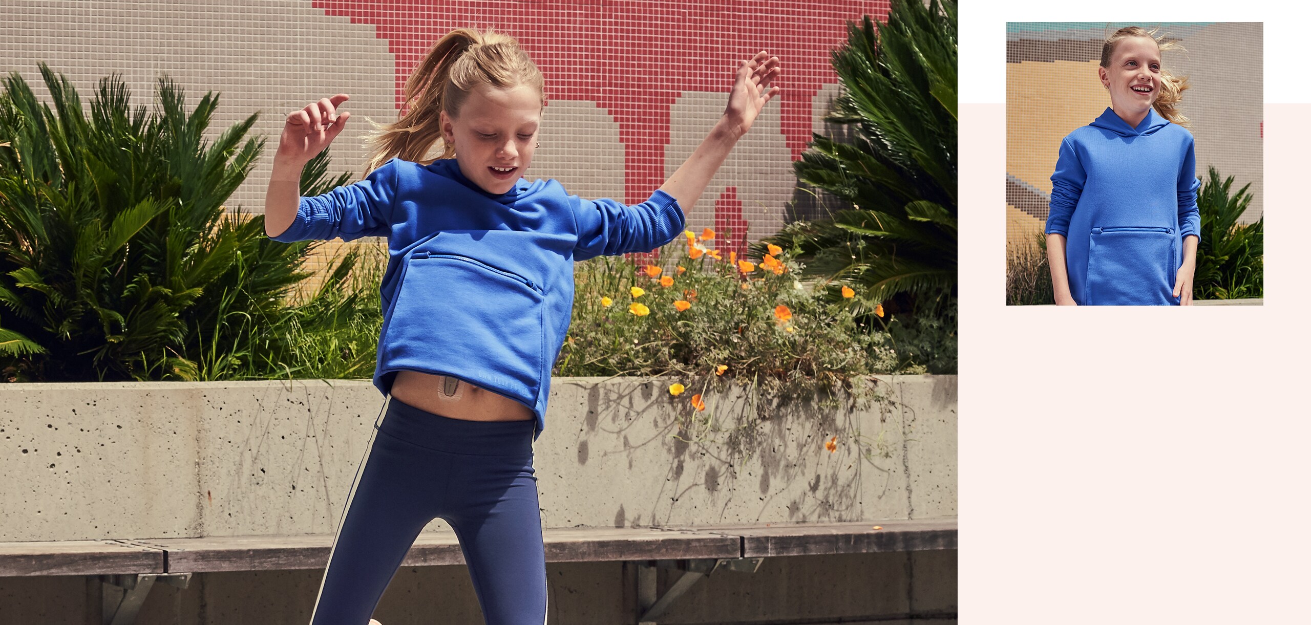 Sabrina plays in the blue sweatshirt she designed for girls with diabetes