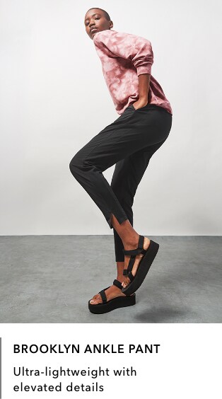 Woman wearing black Brooklyn Ankle Pant: Ultra-lightweight with elevated details.