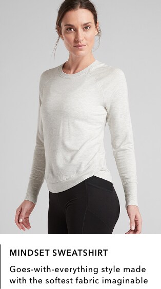 Woman wearing white Mindset Sweatshirt: Goes-with-everything style made with the softwest fabric imaginable.