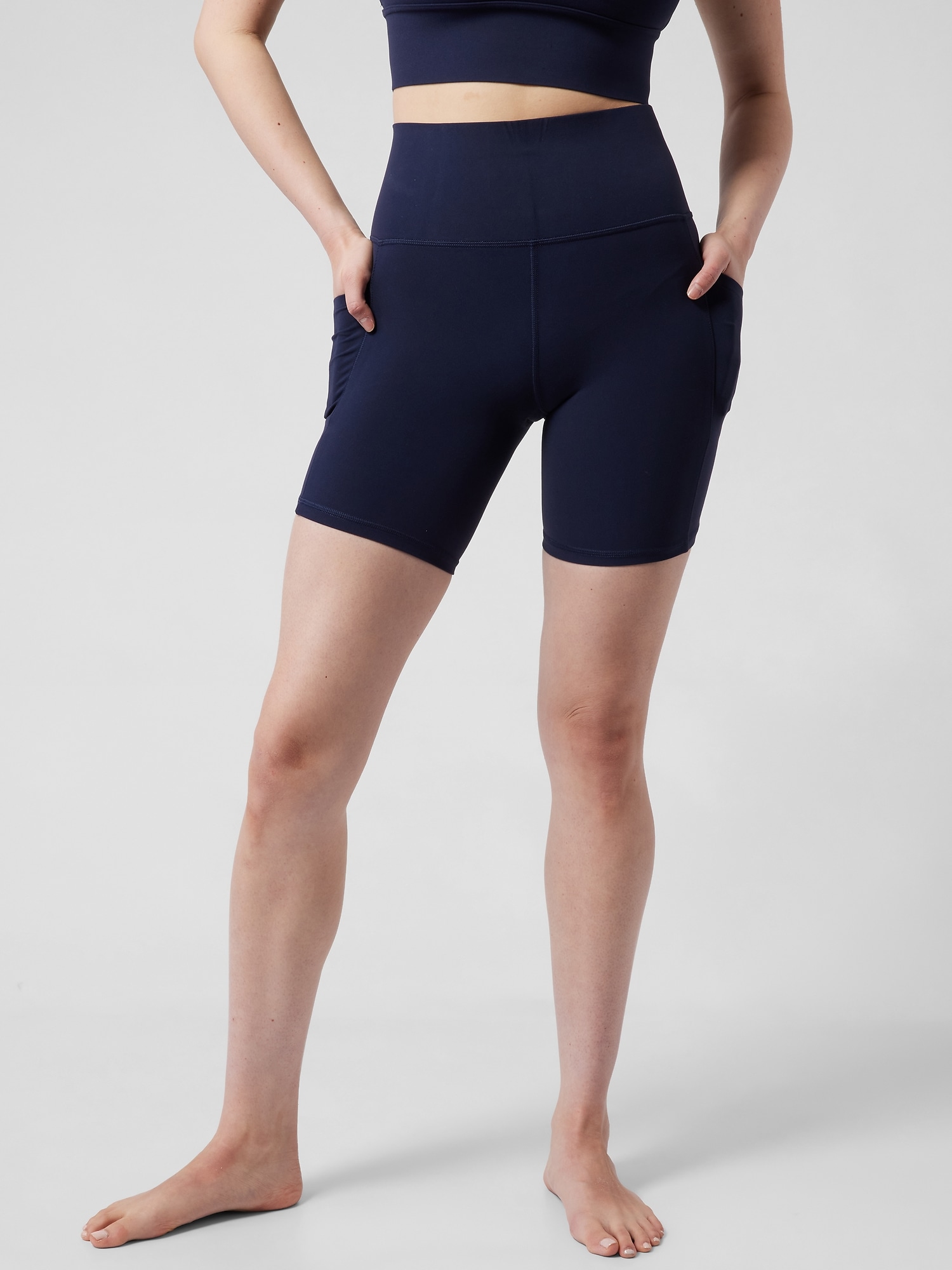 Athleta Salutation Stash High Rise 7 Short blue. 1