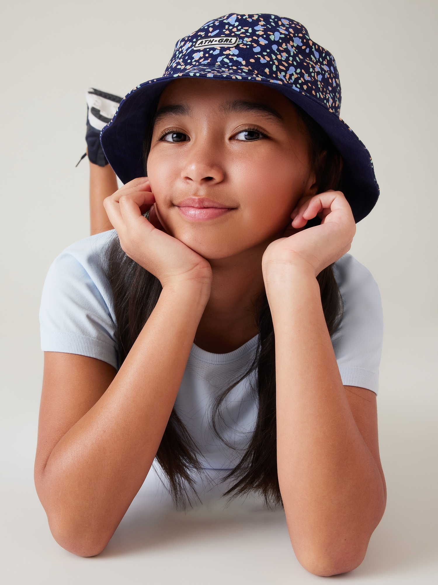 Athleta Girl Reversible Bucket Hat blue. 1