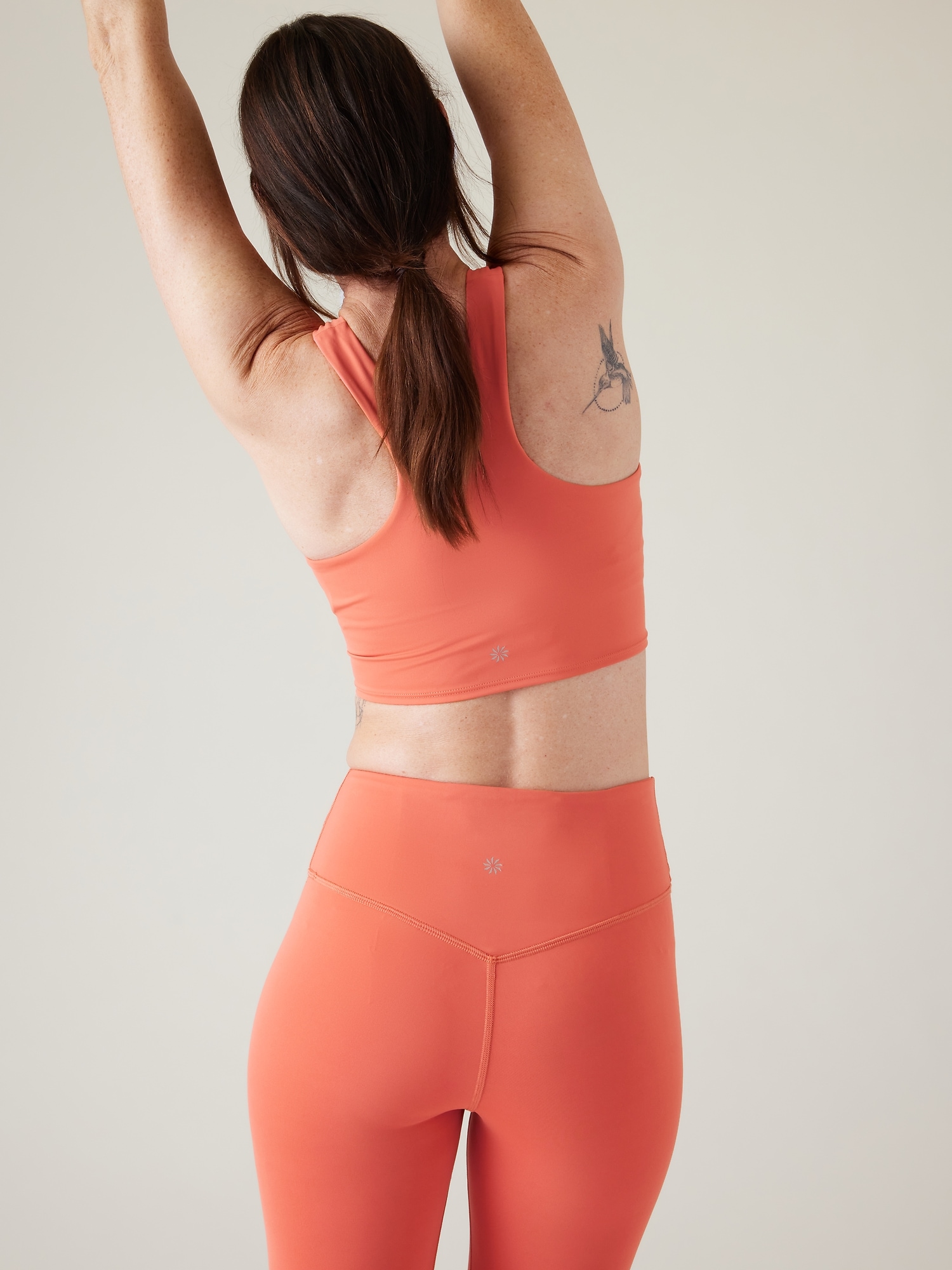 Athleta Conscious Crop Train Logo Bra A&#45C orange. 1