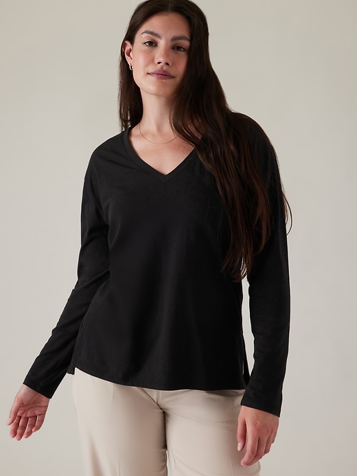 1 of 8 showing, with the color Black of product Outbound V-Neck Top