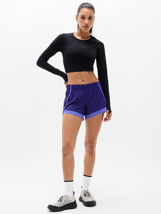 Image number 1 showing, Mesh Racer Run Mid Rise 4" Short