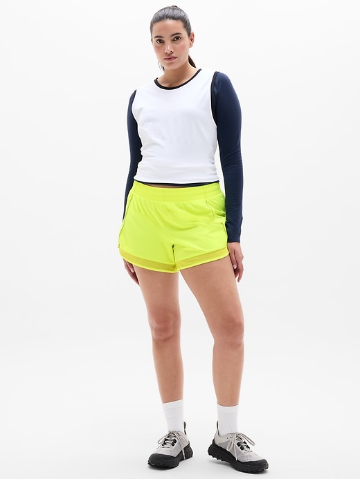 Image number 1 showing, Mesh Racer Run Mid Rise 4" Short